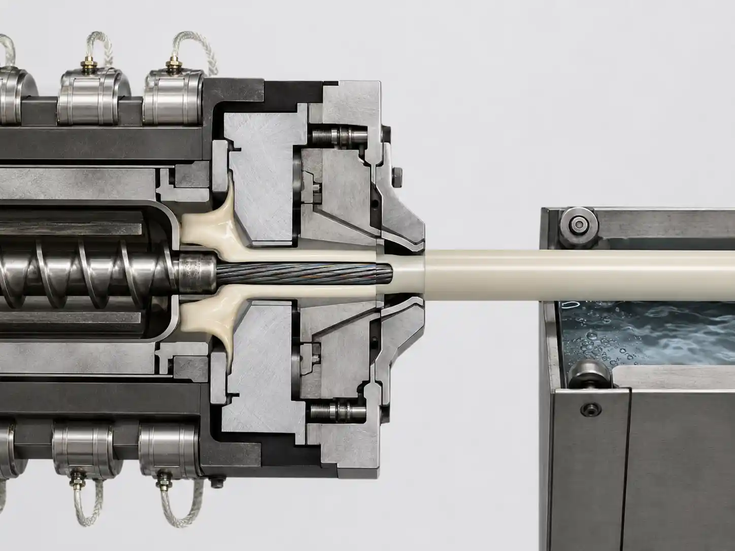 Molten polymer forming a cable sheath in a crosshead Molten polymer forming a cable sheath in a crosshead